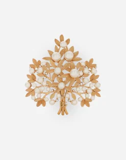 Brooch with branches, leaves and DG logo
