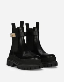 Calfskin ankle boots with branded strap