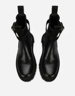 Calfskin ankle boots with branded strap