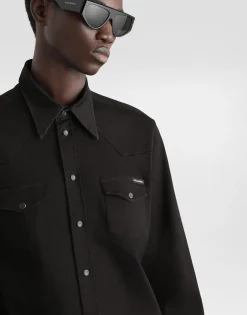 Coated black stretch denim shirt