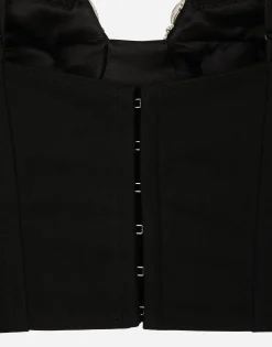 Corset top with rhinestone embellishment