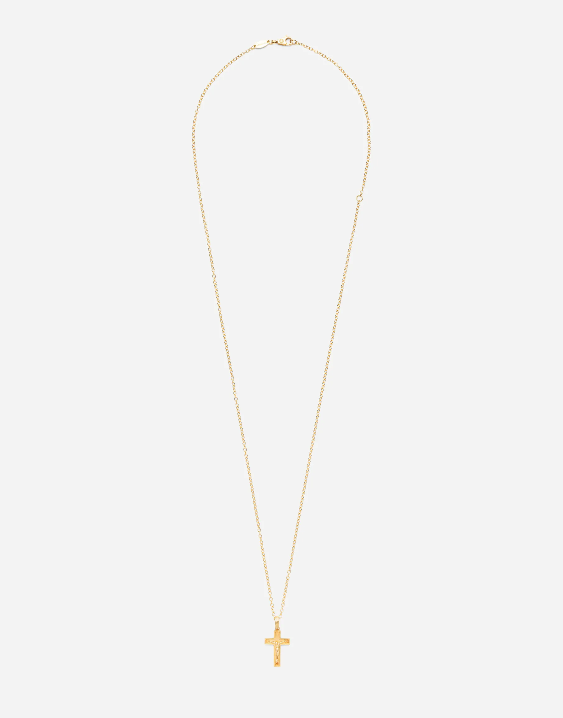 Cross pendant on yellow gold chain