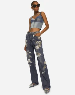 Denim jeans with ripped details and appliqués