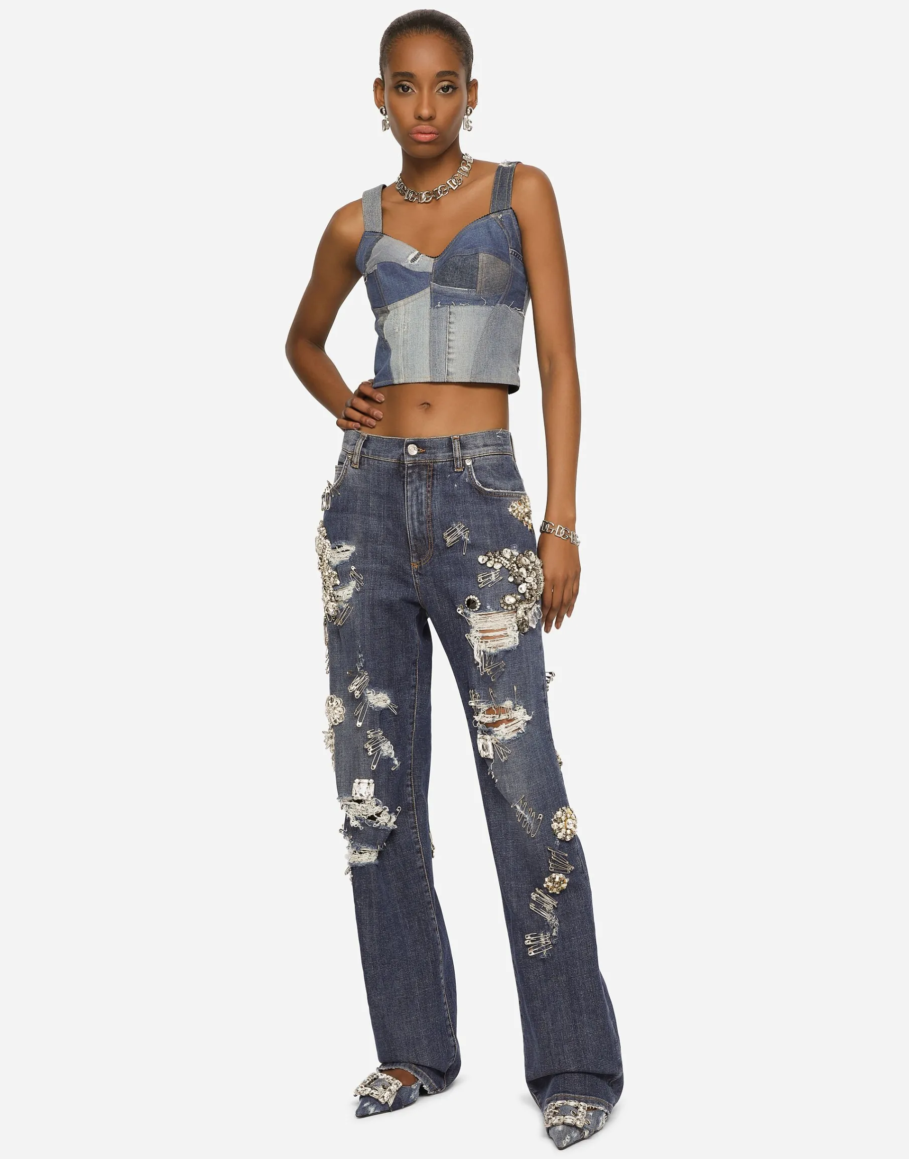 Denim jeans with ripped details and appliqués