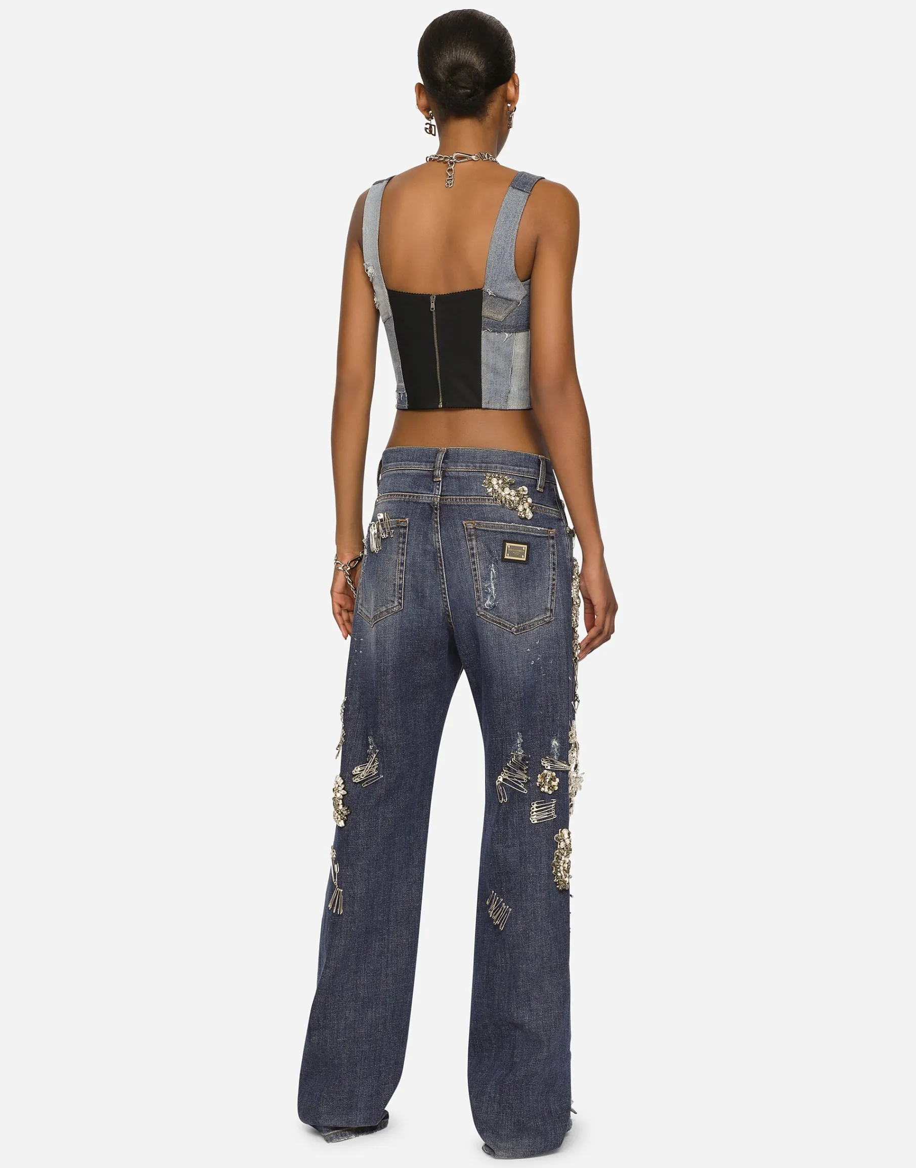 Denim jeans with ripped details and appliqués