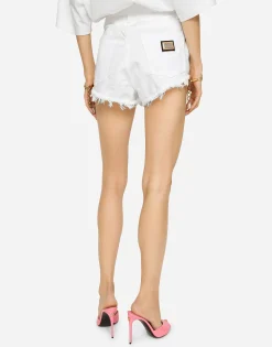 Denim shorts with ripped details and abrasions