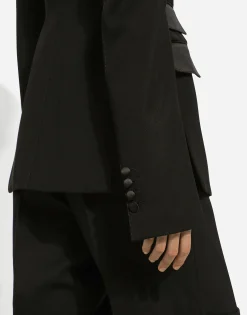 Double-breasted woolen jacket with side vents