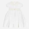Empire-line muslin christening dress with short sleeves