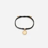 Fabric Devotion bracelet with yellow and white gold pendant charm with diamonds