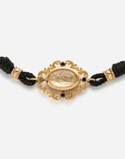 Fabric Devotion bracelet with yellow gold pendant charm