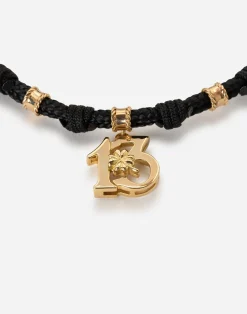 Fabric Good luck bracelet with yellow gold pendant charm