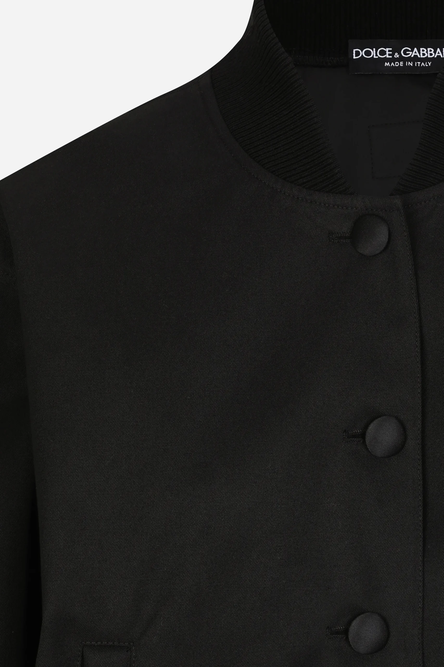 Gabardine bomber jacket, waxed on reverse, with branded tag