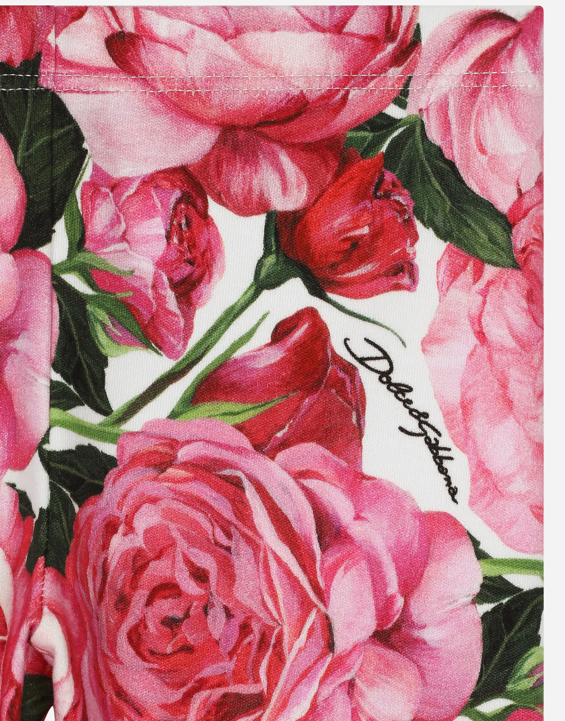 Interlock leggings with rose print over a white background