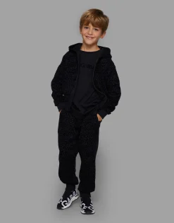 Jersey jogging pants with all-over flocked print