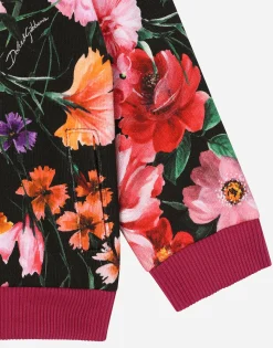 Jersey sweatshirt with floral print over a black background
