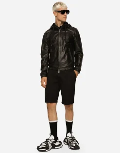 Leather jacket with hood and branded tag