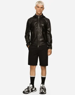 Leather jacket with hood and branded tag