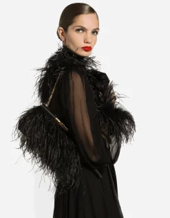 Long silk chiffon dress with ostrich feather details