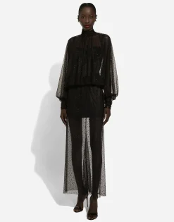 Long tulle dress with full sleeves and fusible rhinestone embellishment