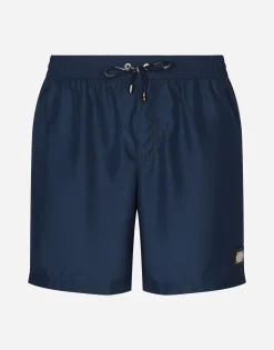 Long-leg swim trunks with branded tag