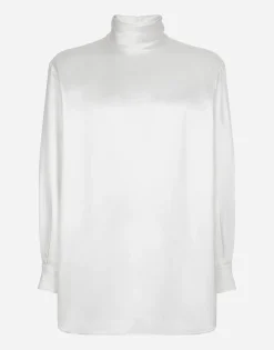 Loose silk turtleneck with shirt cuffs
