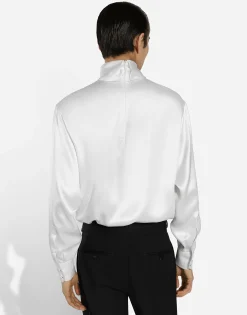 Loose silk turtleneck with shirt cuffs
