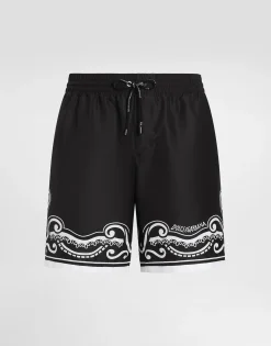 Mid-length swim trunks with bandanna print