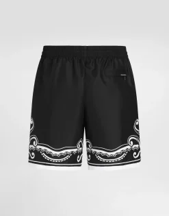 Mid-length swim trunks with bandanna print