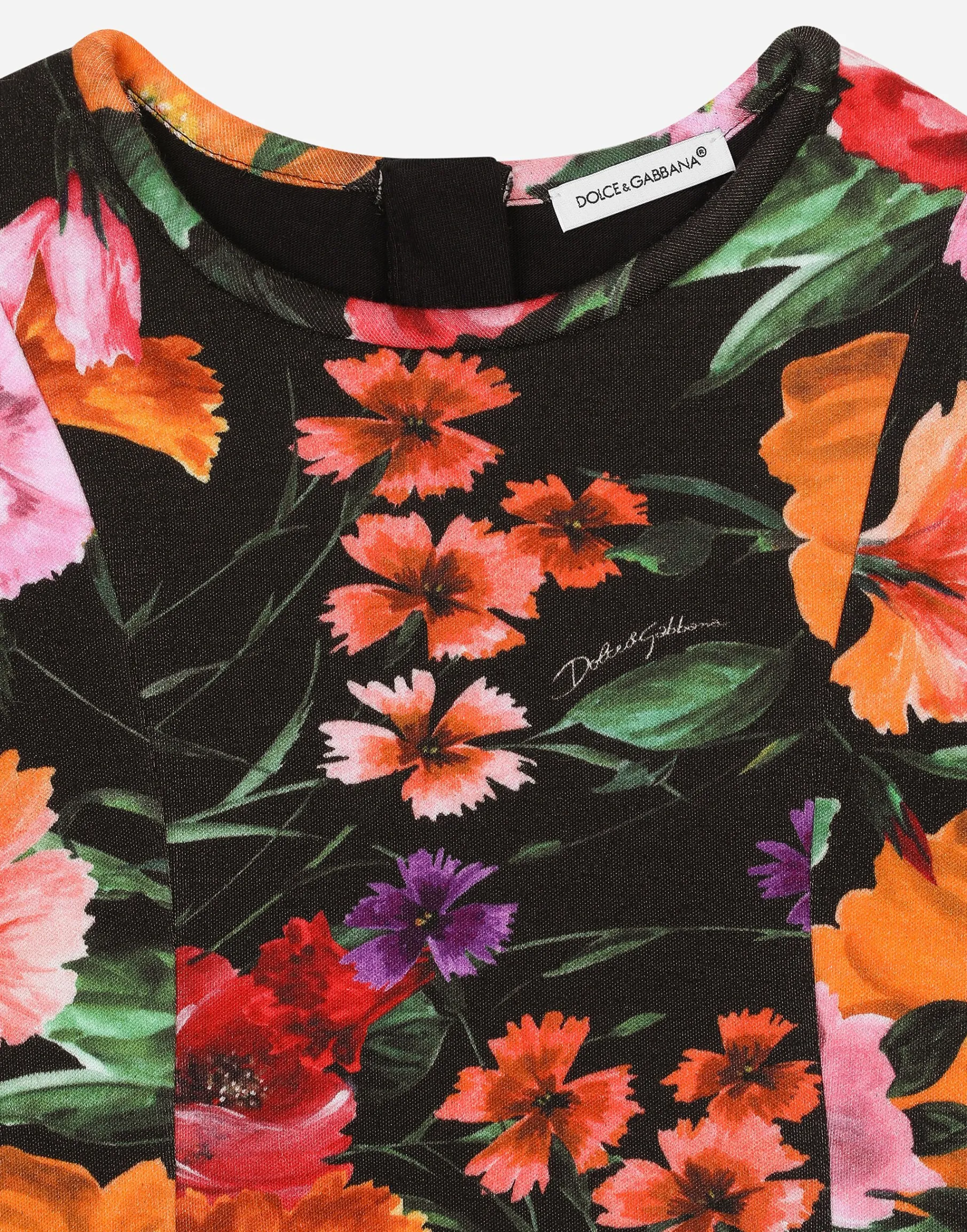 Neoprene dress with floral print over a black background