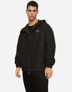 Nylon jacket with hood and branded tag