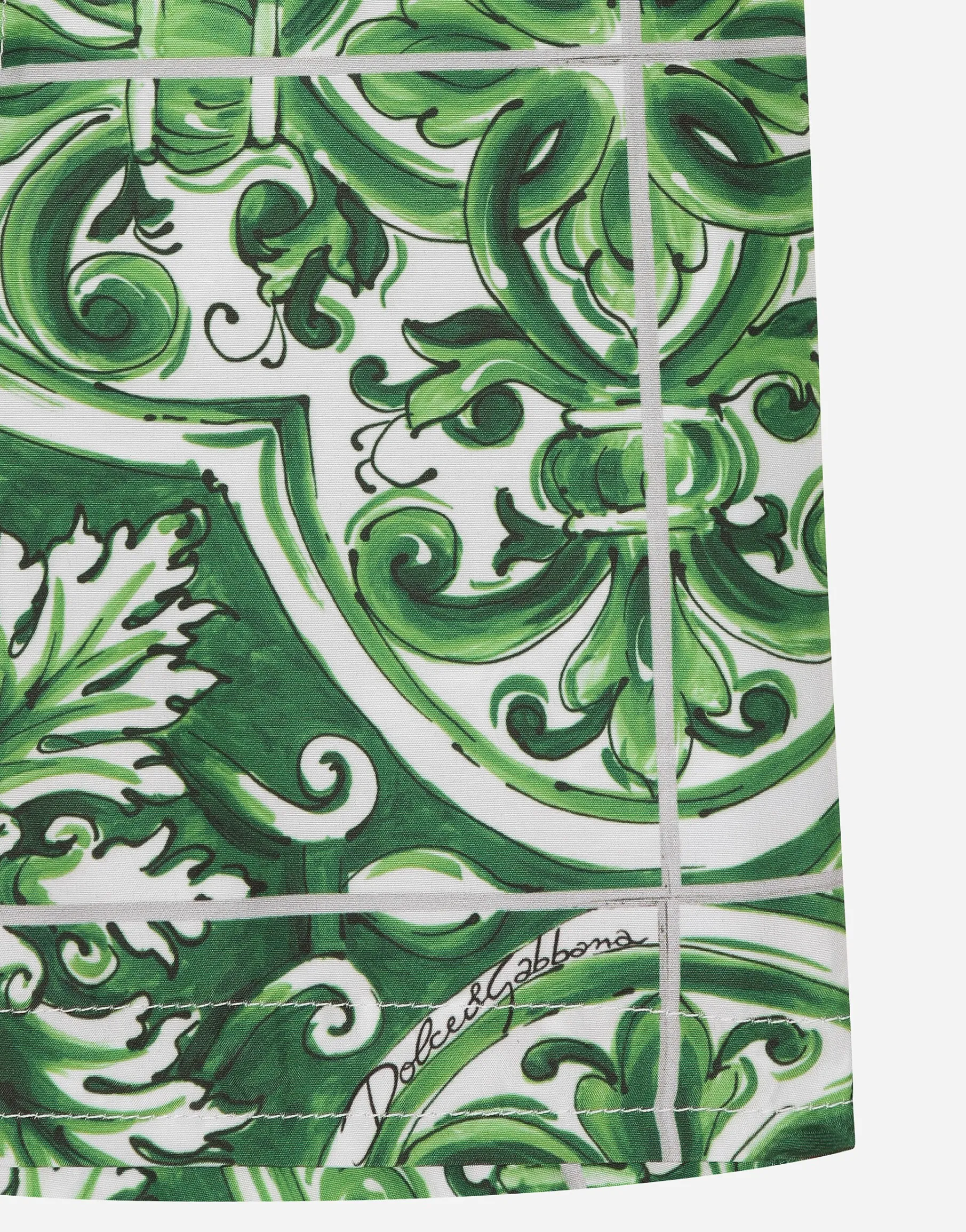 Nylon swim trunks with green majolica print
