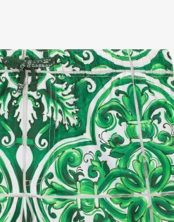 Nylon swim trunks with green majolica print