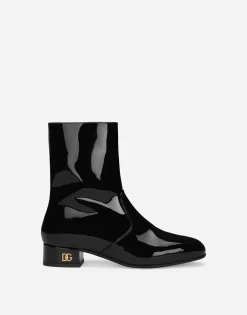 Patent leather ankle boots with branded heel