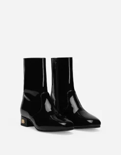 Patent leather ankle boots with branded heel