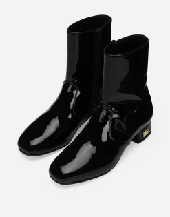 Patent leather ankle boots with branded heel