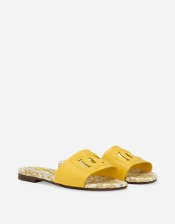 Patent leather sliders with yellow majolica print and cut-out DG detail