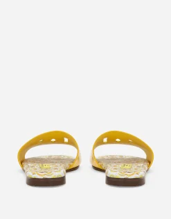 Patent leather sliders with yellow majolica print and cut-out DG detail