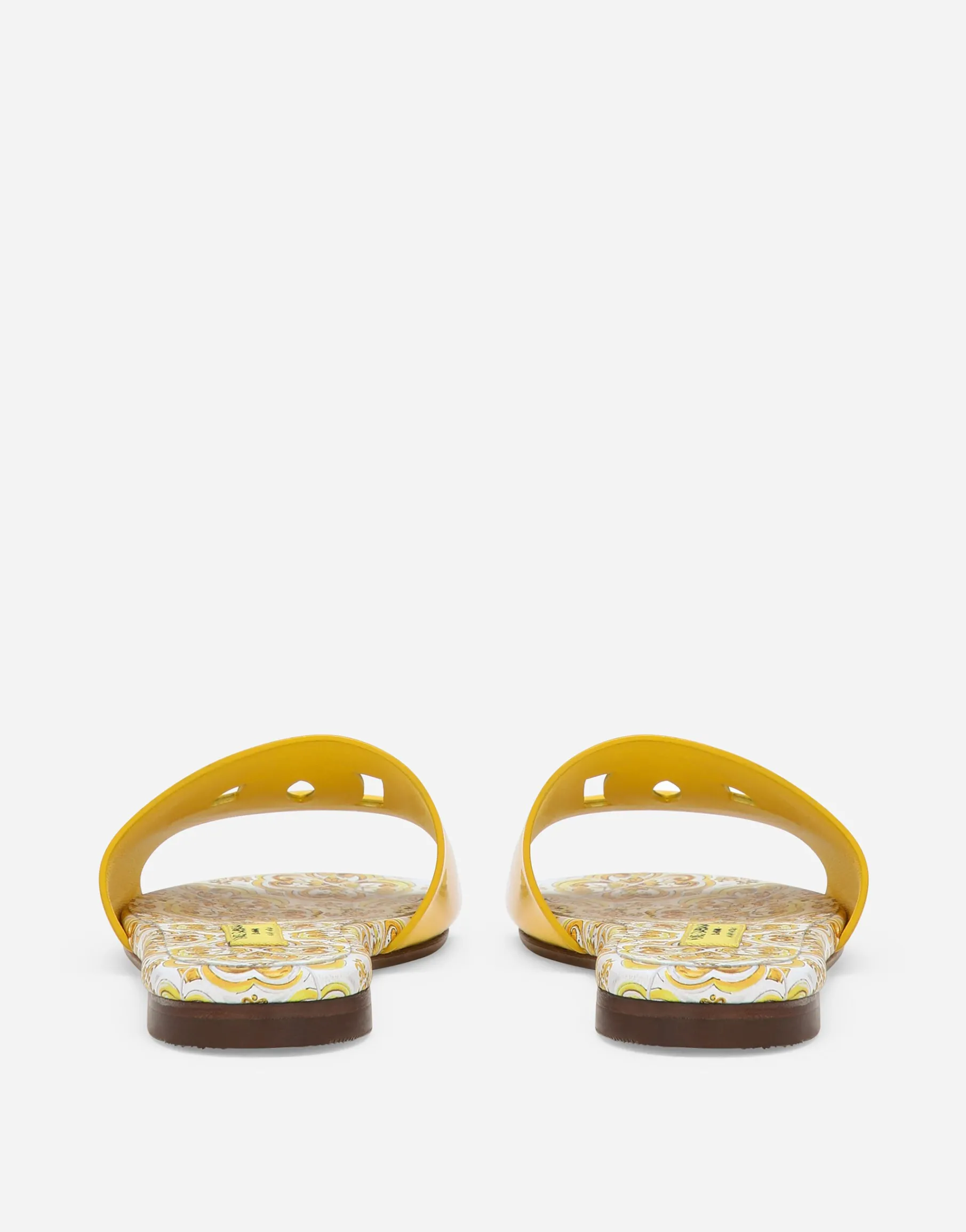 Patent leather sliders with yellow majolica print and cut-out DG detail