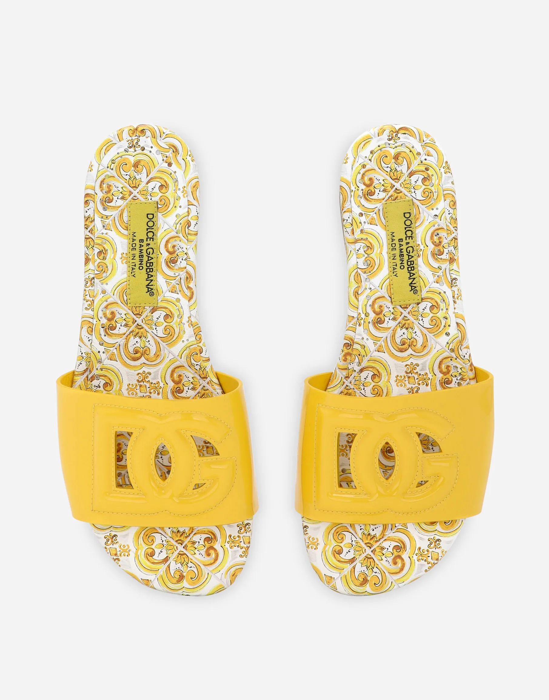 Patent leather sliders with yellow majolica print and cut-out DG detail