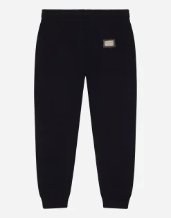 Plain knit jogging pants with logo tag