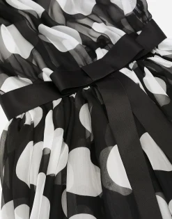 Polka-dot chiffon calf-length dress with piqué details