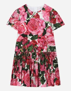 Poplin dress with rose print over a white background