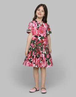 Poplin dress with rose print over a white background