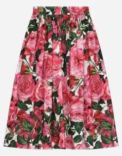 Poplin dress with rose print over a white background