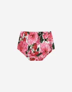 Poplin dress with rose print over a white background