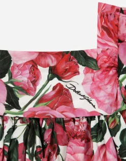 Poplin dress with rose print over a white background