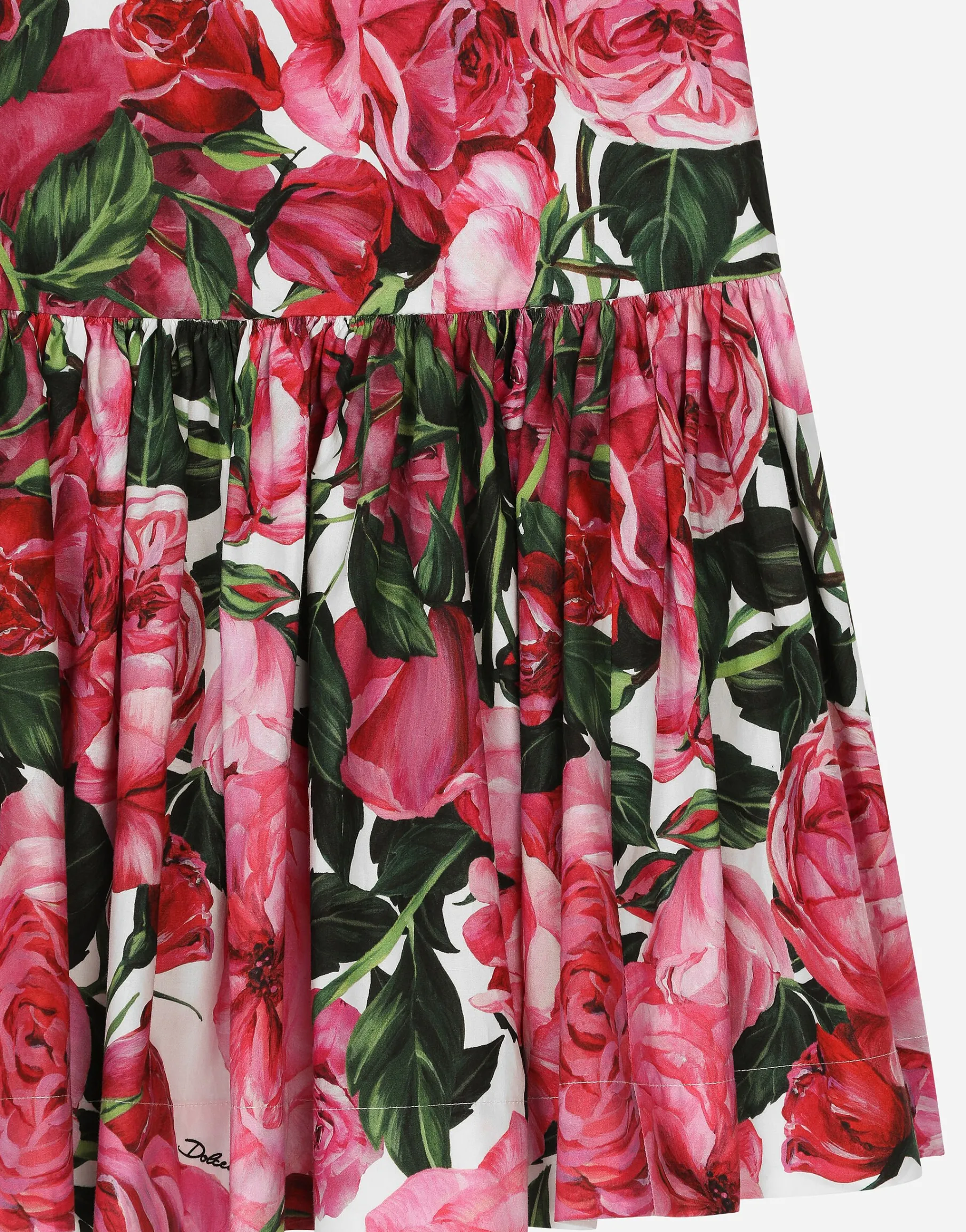 Poplin dress with rose print over a white background