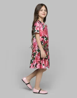 Poplin dress with rose print over a white background