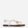 Raffia thong sandals with embroidered votive medallions