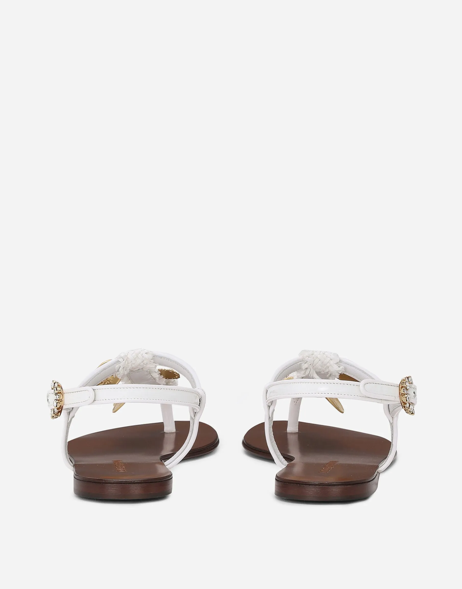 Raffia thong sandals with embroidered votive medallions